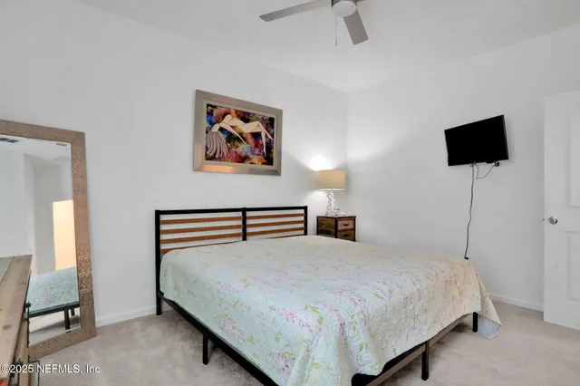 an aerial view of a house with a lake view