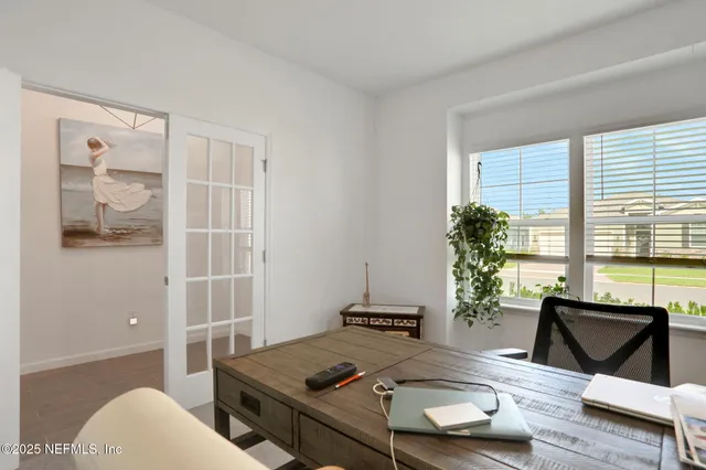 a kitchen with stainless steel appliances a stove a sink a microwave and refrigerator