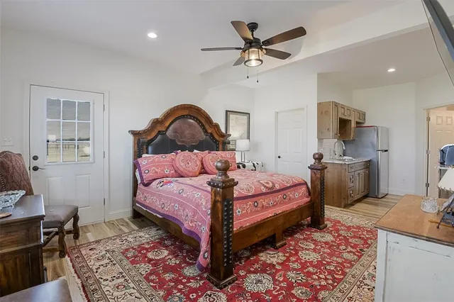 a bed room with a bed and a chair