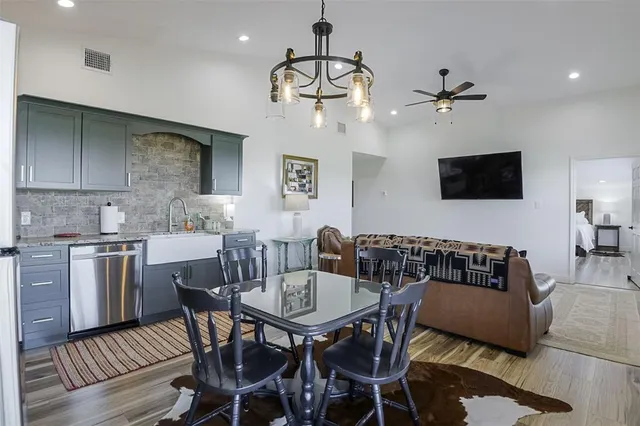 a view of a dining room with furniture and wooden floor