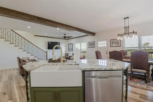 a room with furniture a clock and white walls