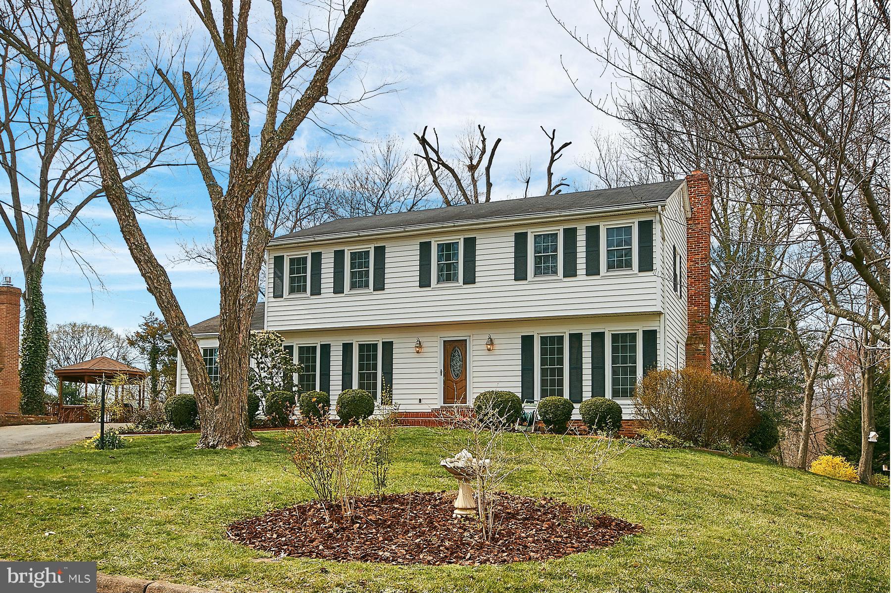 1744 Lockerbie Lane Vienna, VA 22182 - Photo 2 of 30 a front view of a house with garden