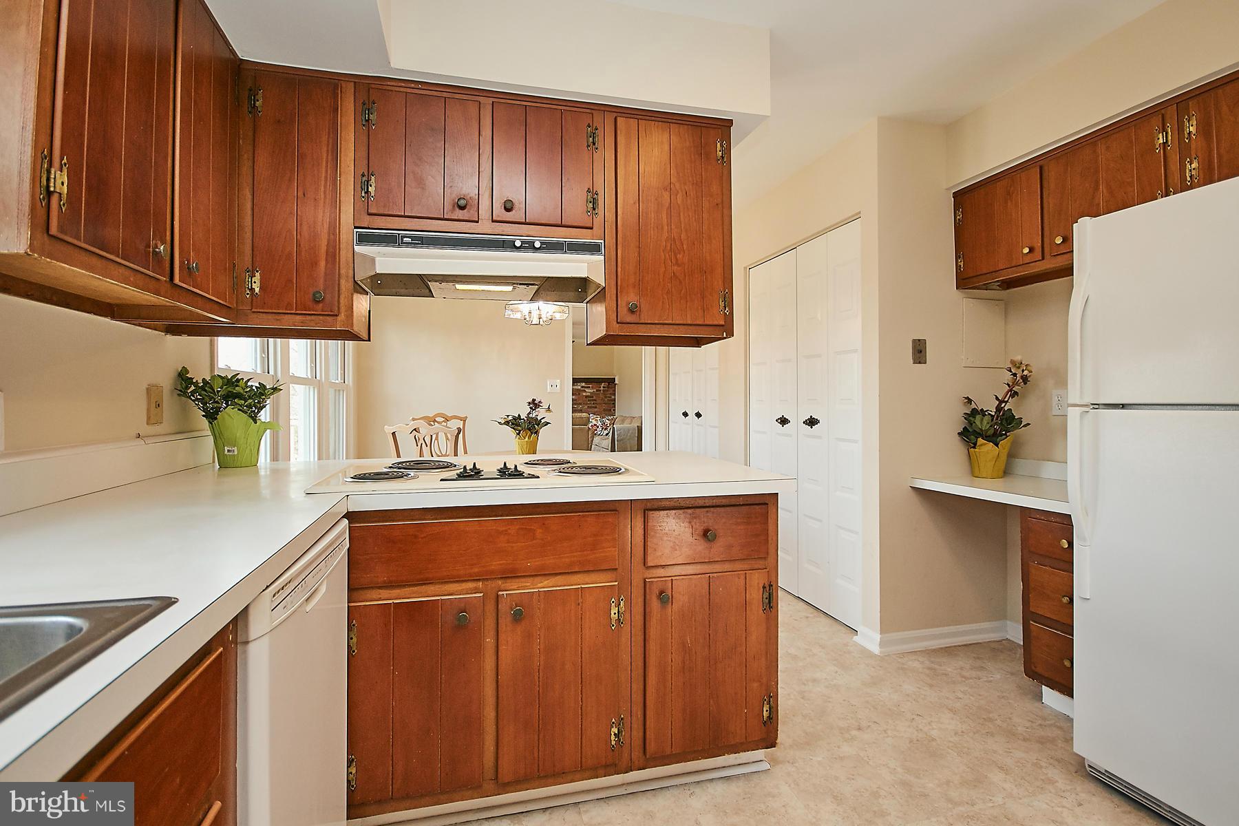 1744 Lockerbie Lane Vienna, VA 22182 - Photo 12 of 30 a kitchen with cabinets and a refrigerator