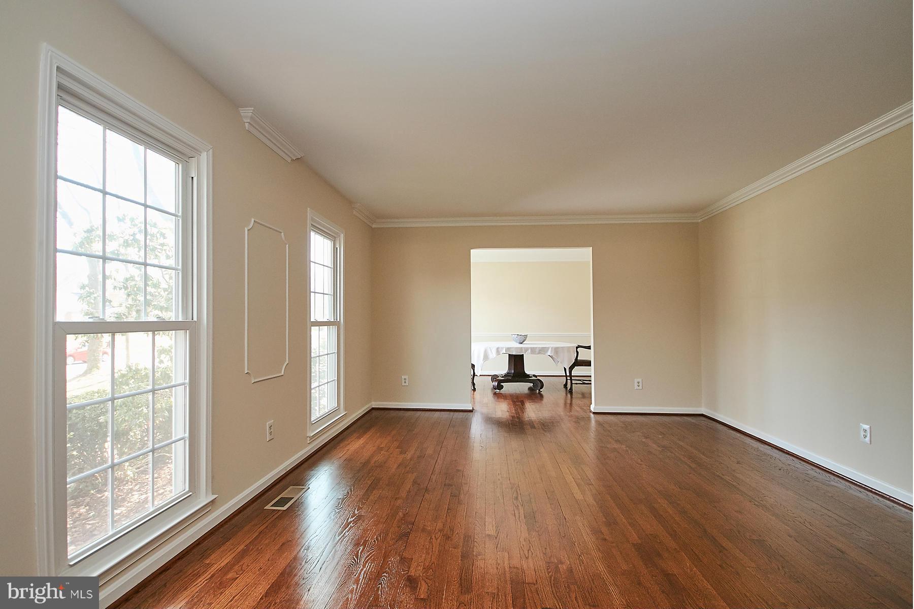 1744 Lockerbie Lane Vienna, VA 22182 - Photo 14 of 30 wooden floor in an empty room with a window