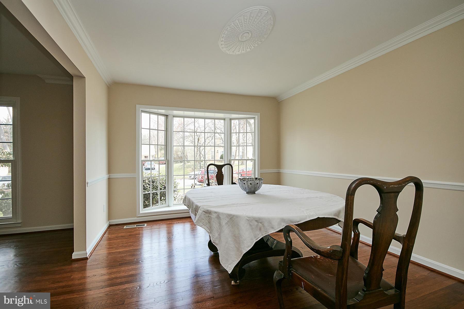 1744 Lockerbie Lane Vienna, VA 22182 - Photo 15 of 30 a view of a dining room with furniture and wooden floor