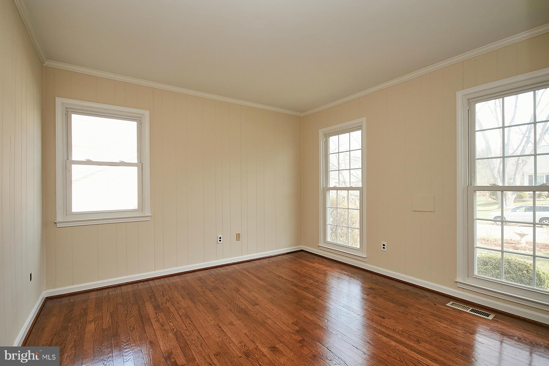 1744 Lockerbie Lane Vienna, VA 22182 - Photo 16 of 30 an empty room with wooden floor and windows