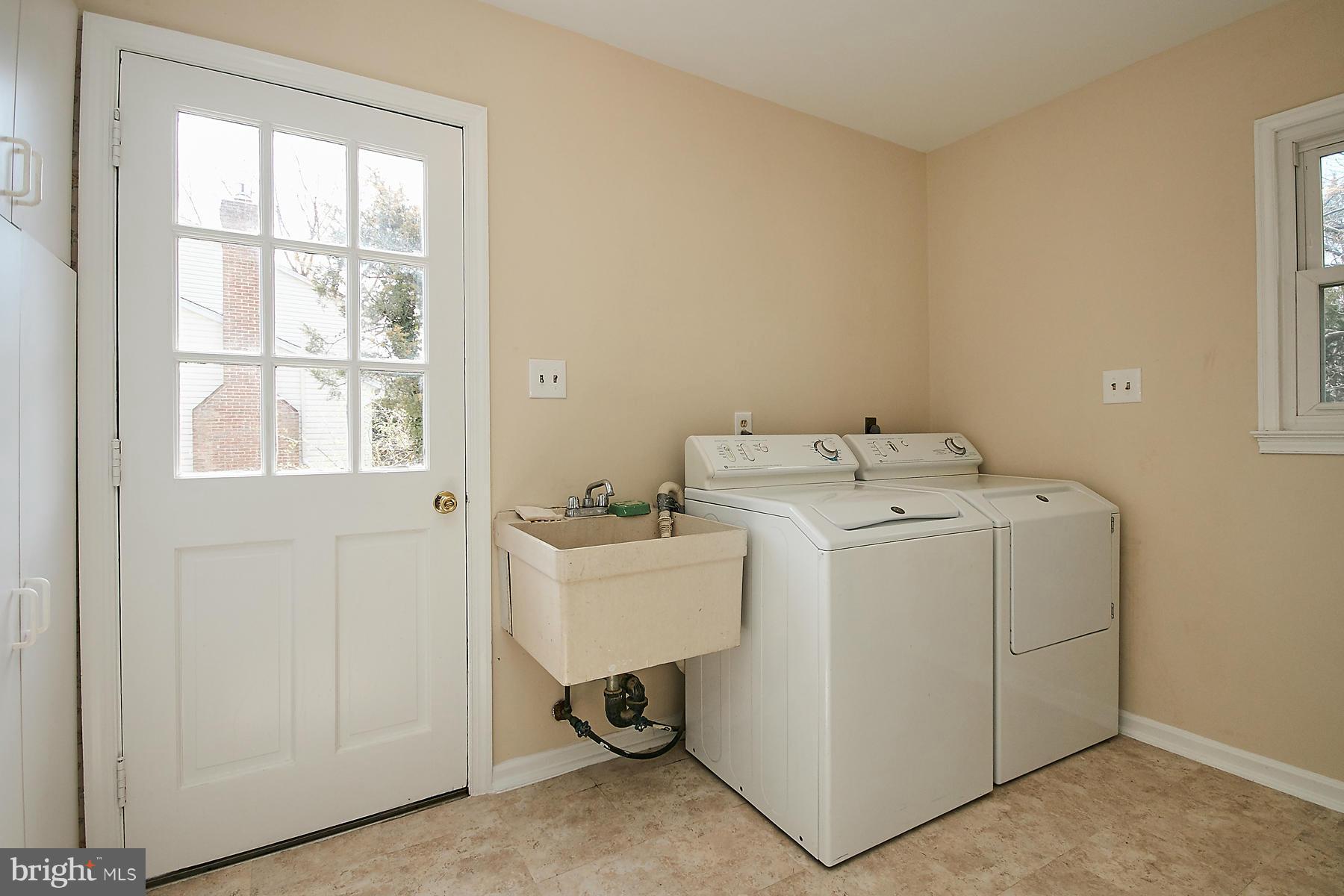 1744 Lockerbie Lane Vienna, VA 22182 - Photo 17 of 30 a utility room with dryer and washer