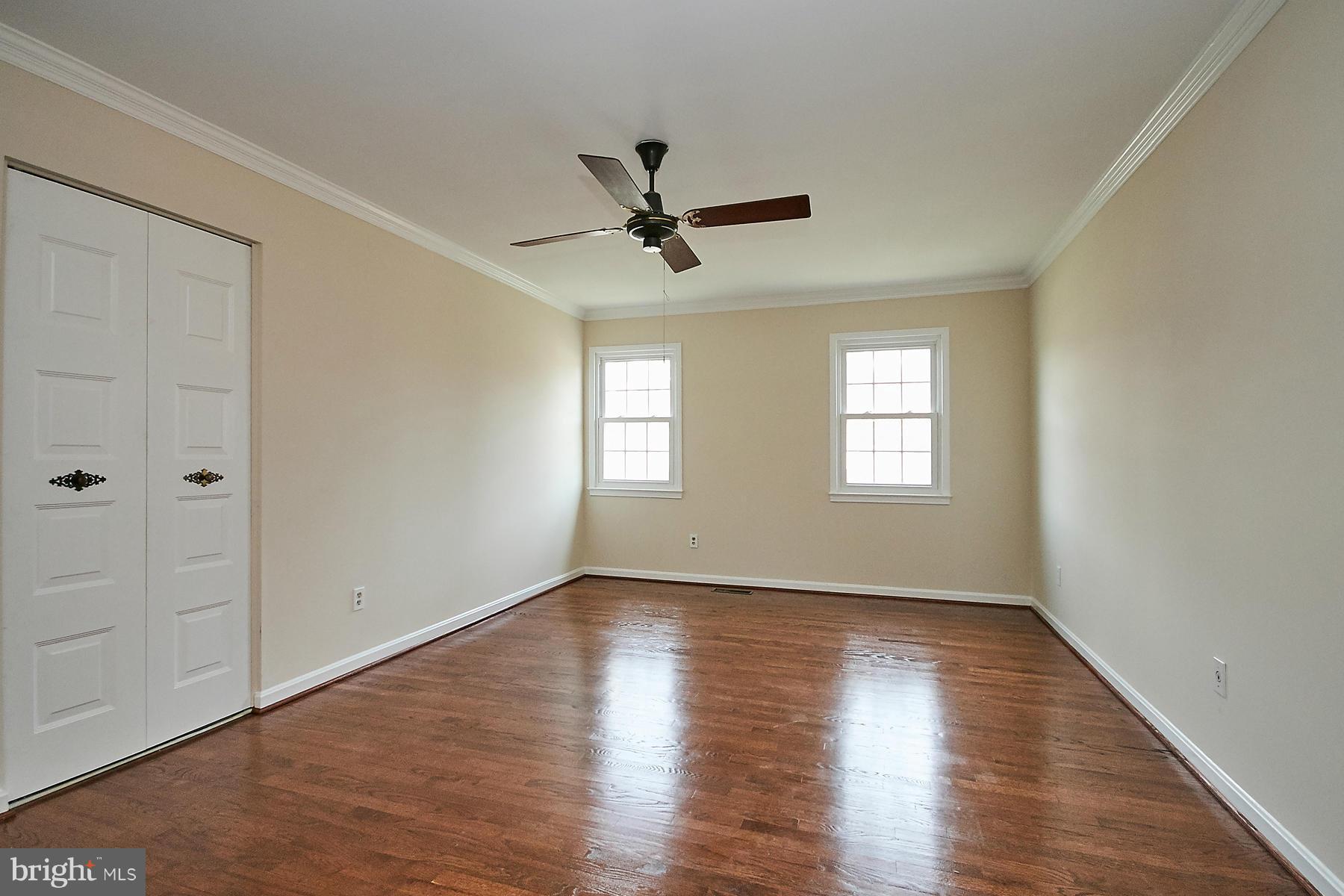 1744 Lockerbie Lane Vienna, VA 22182 - Photo 19 of 30 wooden floor in an empty room with a window