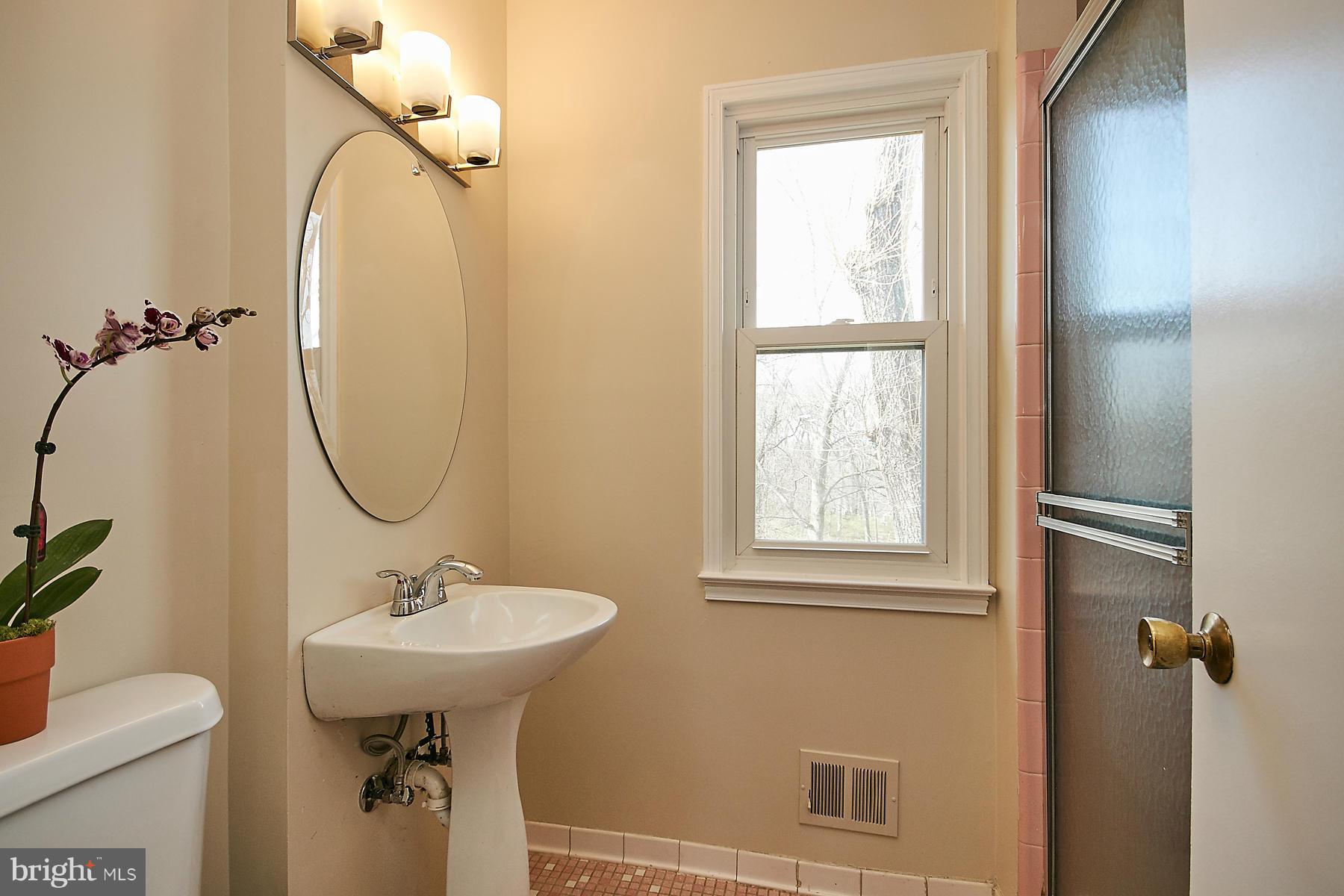 1744 Lockerbie Lane Vienna, VA 22182 - Photo 21 of 30 a bathroom with a sink toilet and a mirror