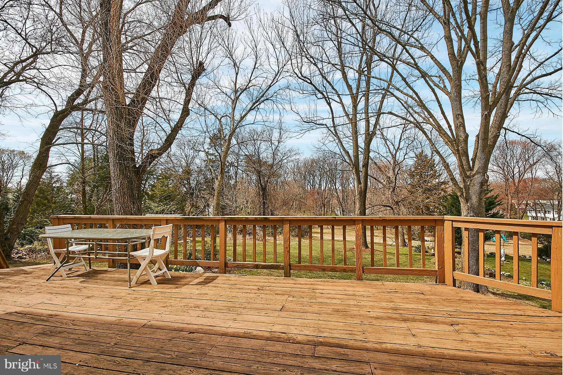 1744 Lockerbie Lane Vienna, VA 22182 - Photo 4 of 30 a view of house with deck and trees