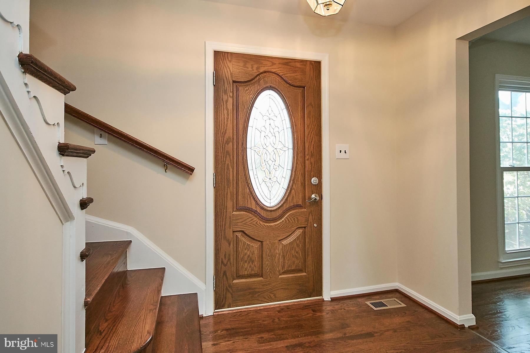 1744 Lockerbie Lane Vienna, VA 22182 - Photo 6 of 30 a view of entryway with wooden floor