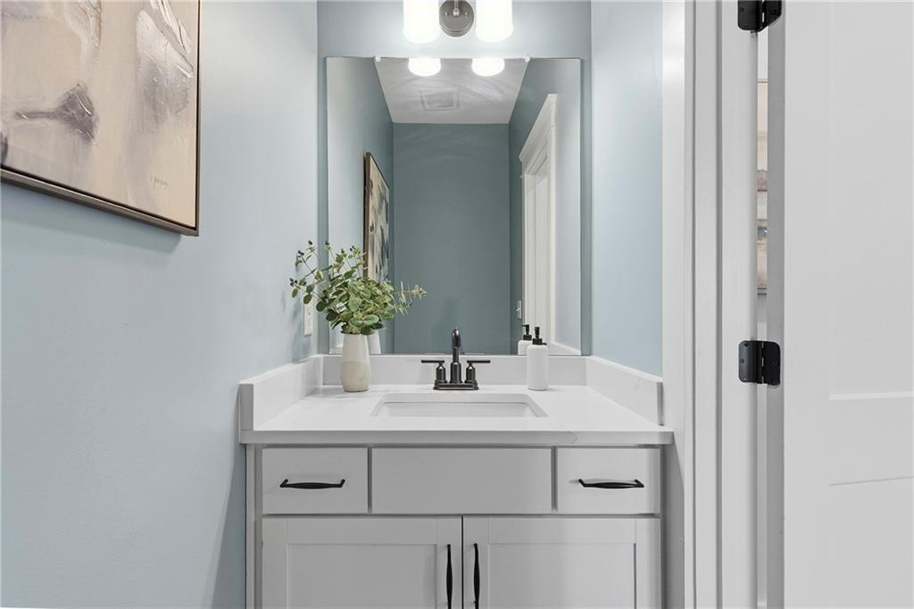 203 Sunshower Ridge Canton, GA 30114 - Photo 18 of 58 a bathroom with a sink and a mirror