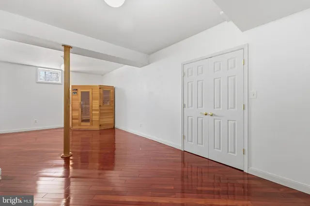 a bathroom with a granite countertop toilet a sink and a bathtub