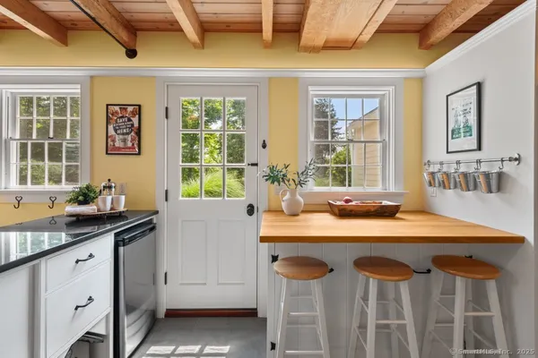 a kitchen with a stove a sink and a refrigerator