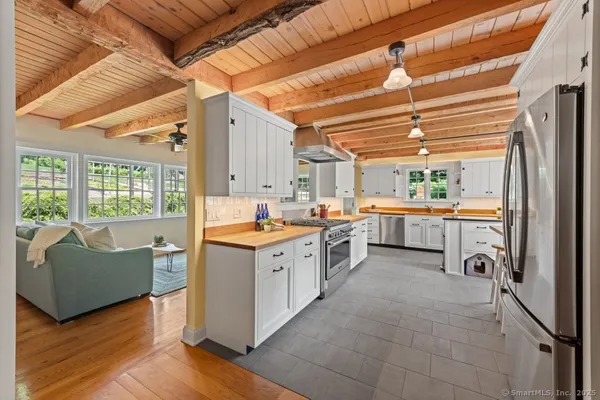 a large kitchen with a large window