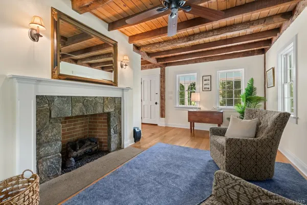 a living room with furniture and a fireplace