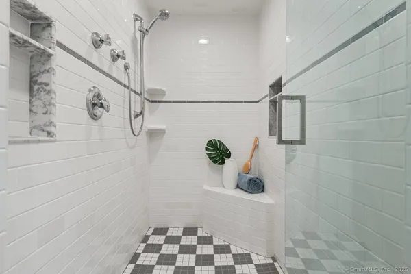 a bathroom with a bathtub and a shower