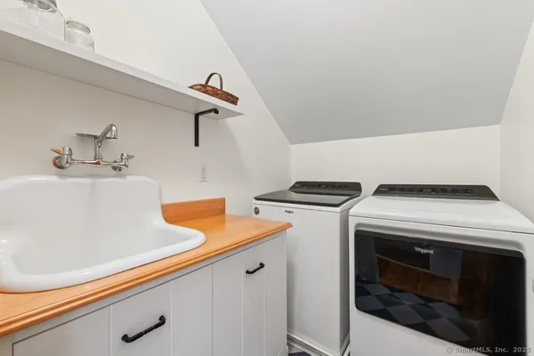 a utility room with dryer and washer