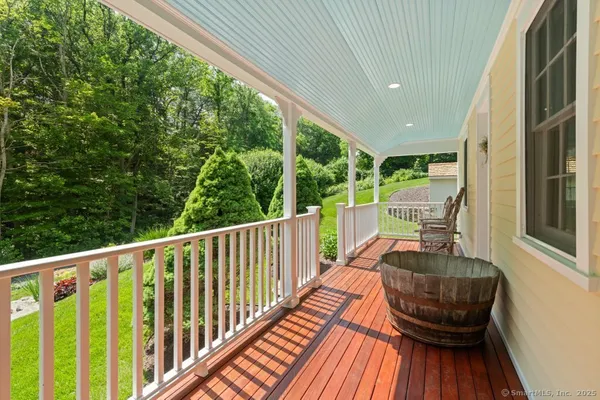 a view of balcony with furniture