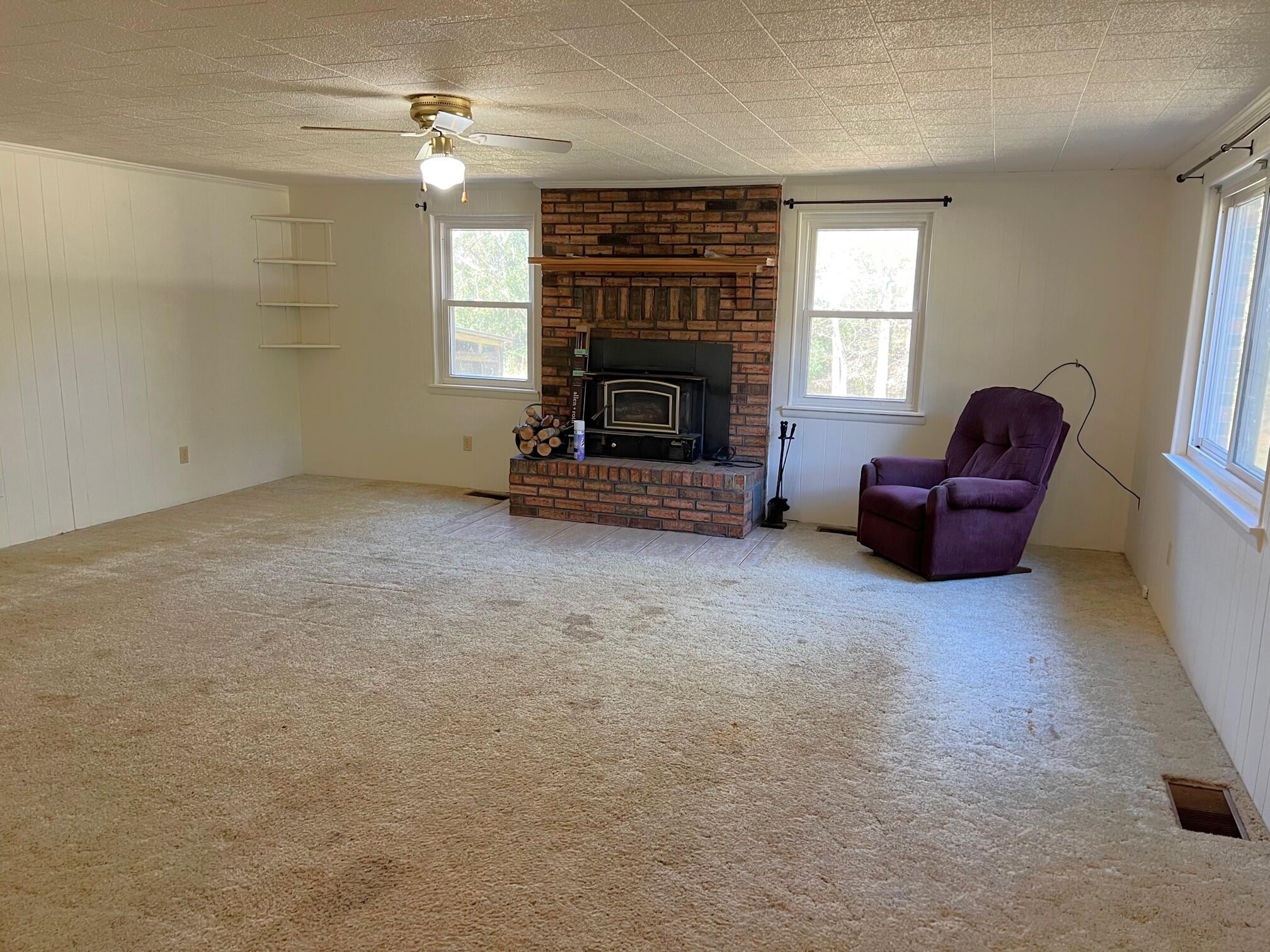 401 Mims Road DeFuniak Springs, FL 32433 - Photo 18 of 78 a living room with furniture and a fireplace