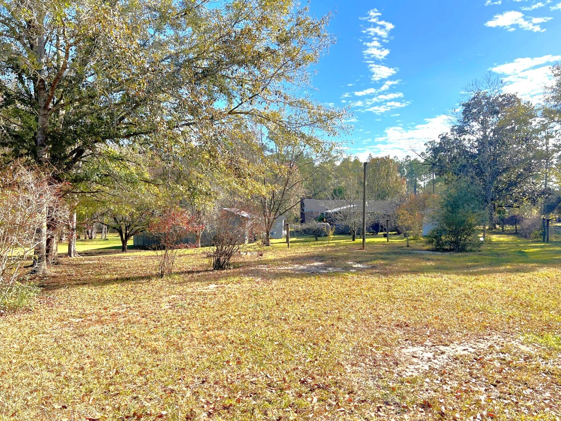 401 Mims Road DeFuniak Springs, FL 32433 - Photo 53 of 78 a view of a swimming pool with an outdoor space