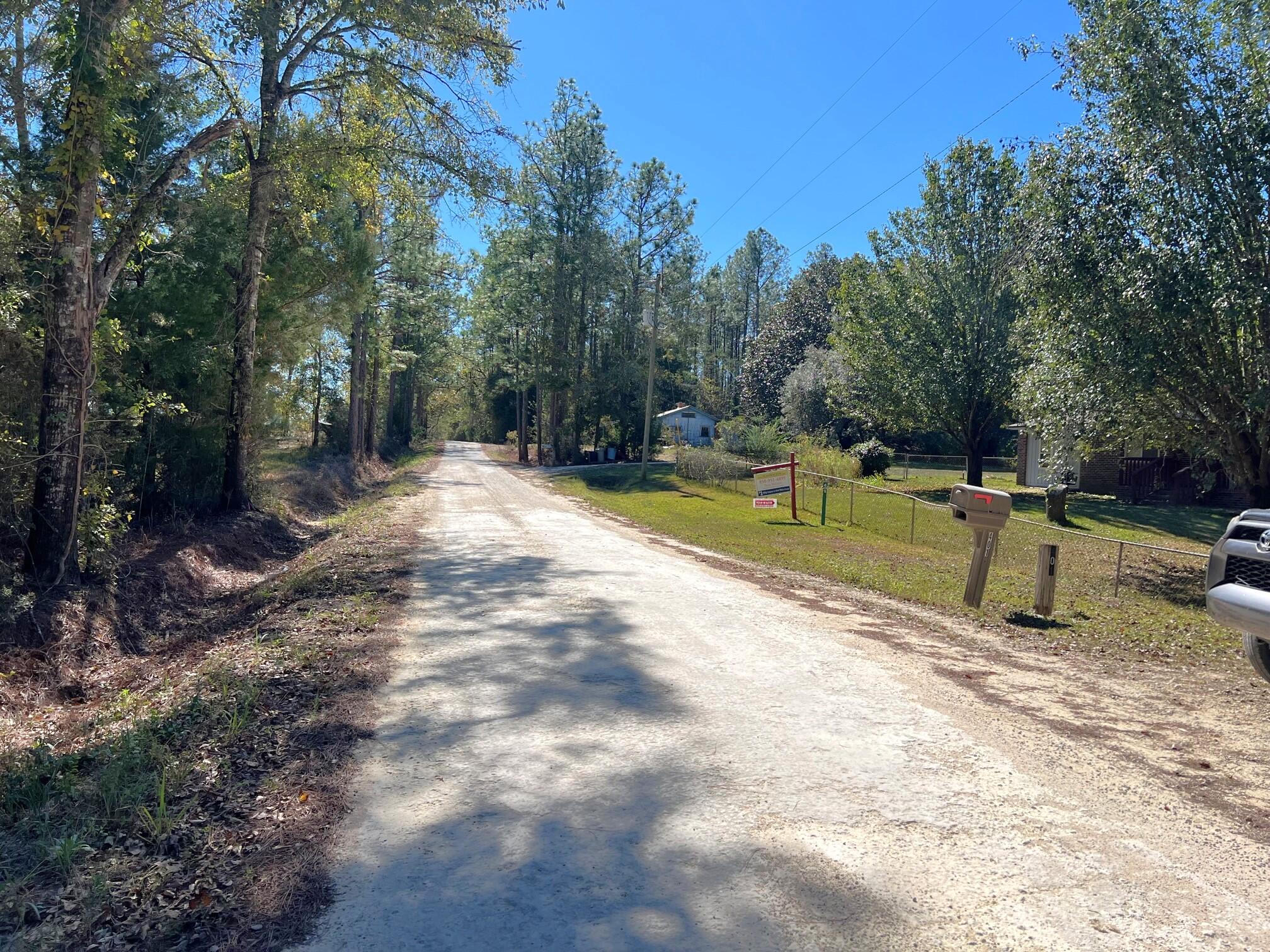 401 Mims Road DeFuniak Springs, FL 32433 - Photo 76 of 78 a view of a swimming pool with a yard