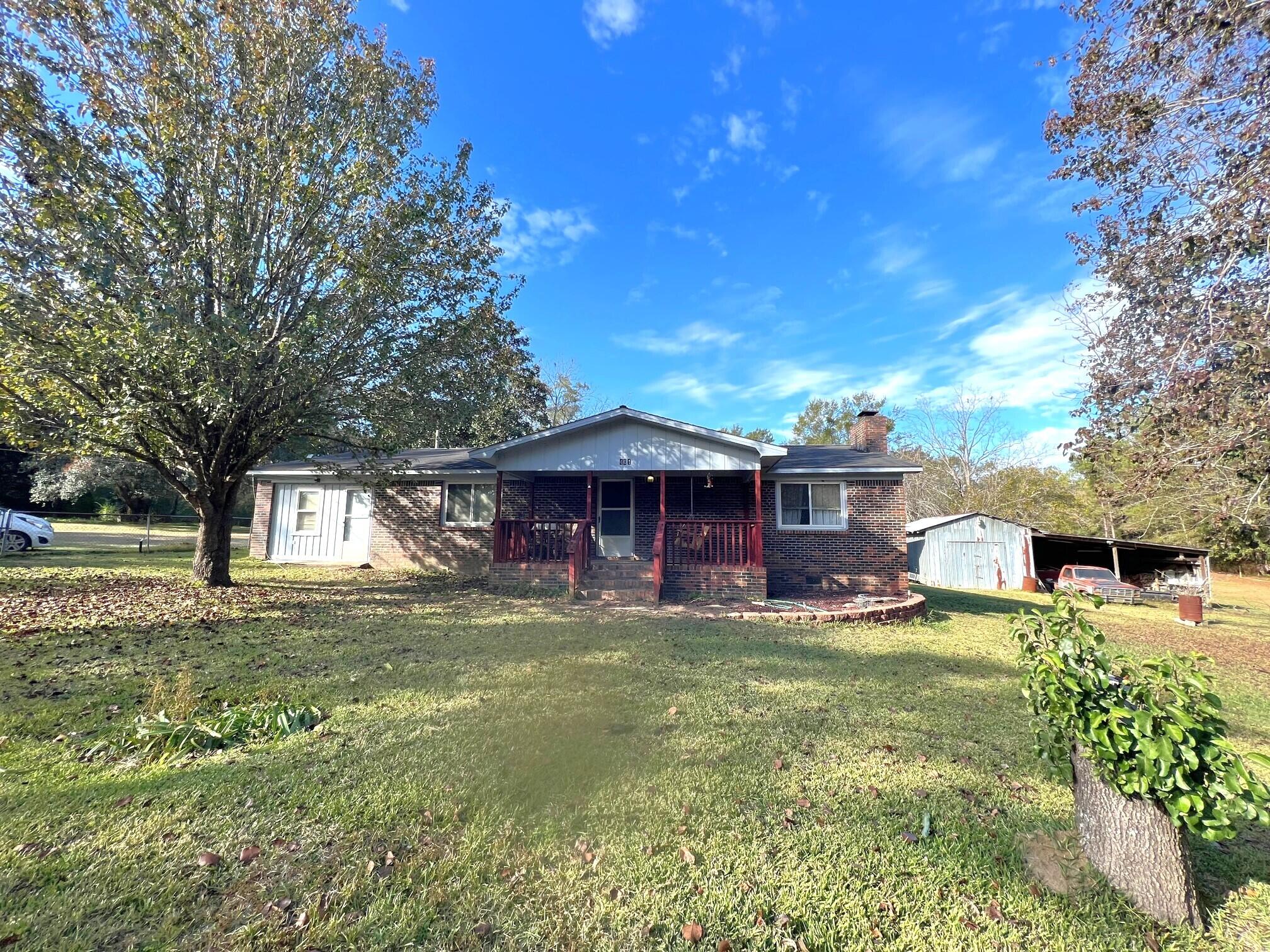 401 Mims Road DeFuniak Springs, FL 32433 - Photo 8 of 78 a view of a house with a big yard and large tree