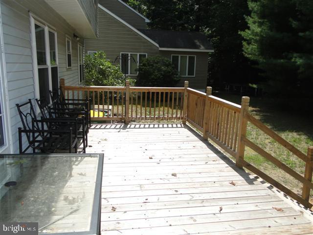 172 Windjammer Road Ocean Pines, MD 21811 - Photo 11 of 24 a view of balcony with wooden floor and outdoor seating