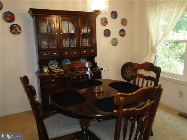 172 Windjammer Road Ocean Pines, MD 21811 - Photo 4 of 24 a dining room with furniture and wooden floor