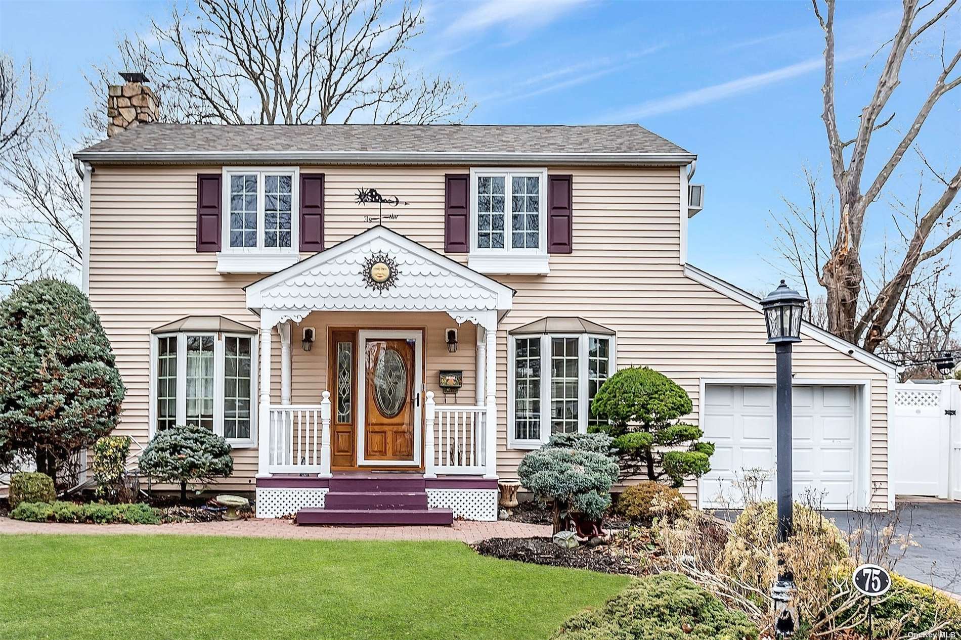 75 Crest Road East Merrick, NY 11566 - Photo 1 of 1 a front view of a house with a yard