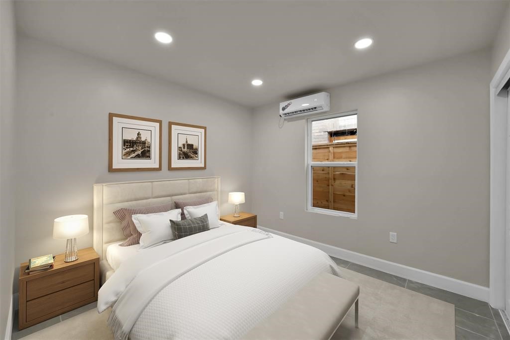 2304 Chapman Street, Unit 3 Houston, TX 77009 - Photo 11 of 17 a bedroom with a large bed and a window