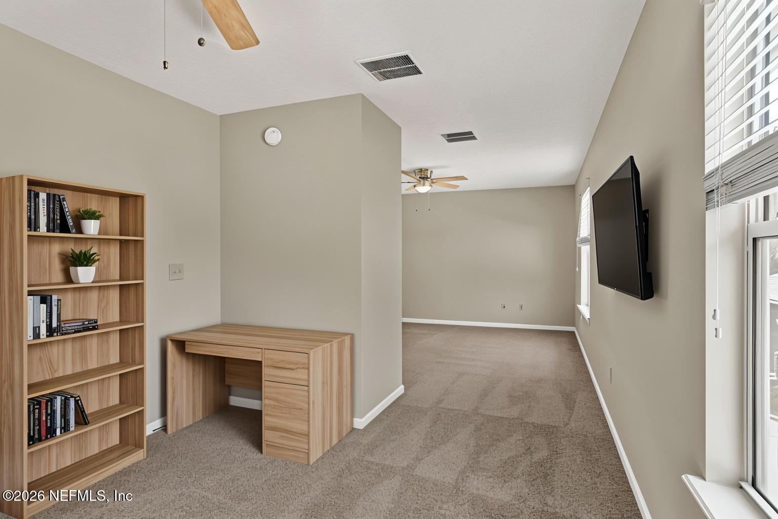900 Country Bridge Road, Unit 3 St. Johns, FL 32259 - Photo 12 of 18 a view of a livingroom with furniture and cabinet