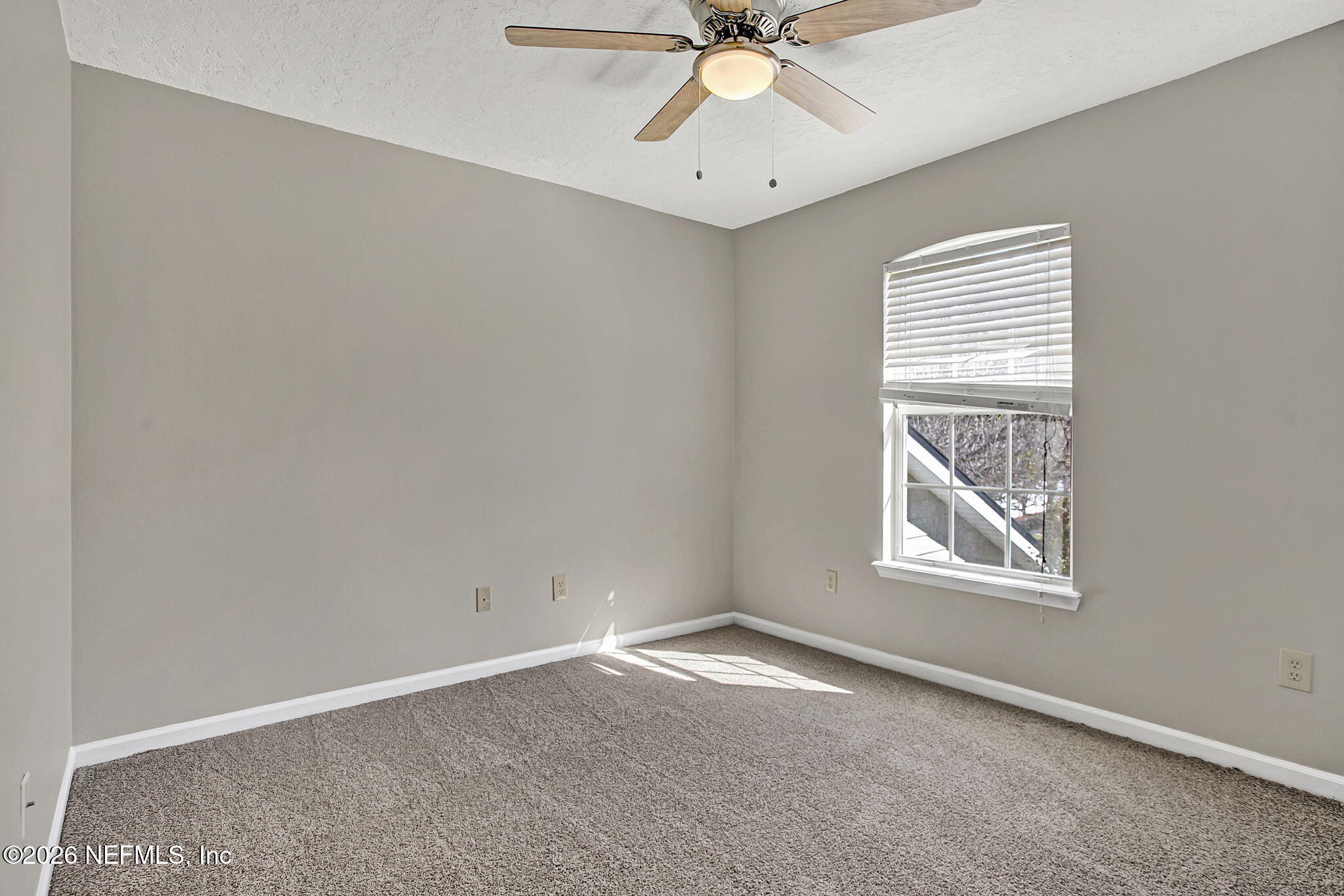 900 Country Bridge Road, Unit 3 St. Johns, FL 32259 - Photo 15 of 18 an empty room with windows and fan