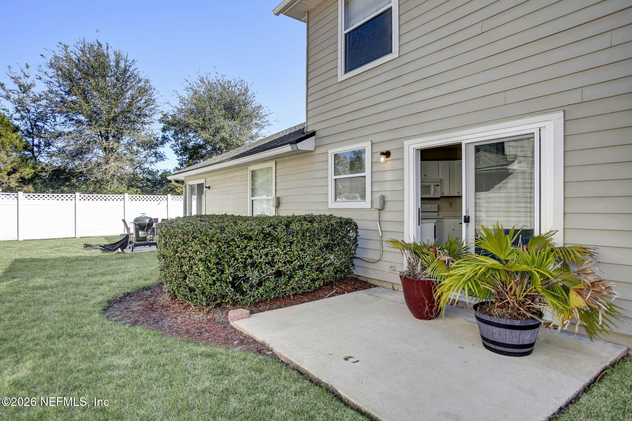 900 Country Bridge Road, Unit 3 St. Johns, FL 32259 - Photo 17 of 18 a front view of a house with a garden