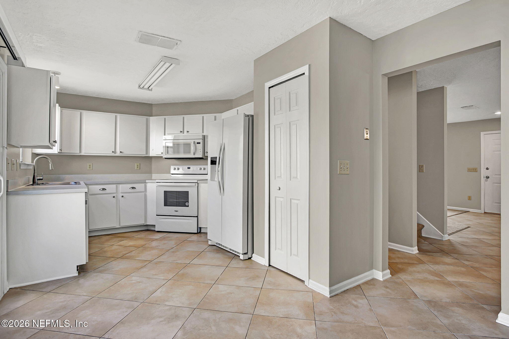 900 Country Bridge Road, Unit 3 St. Johns, FL 32259 - Photo 5 of 18 a kitchen with stainless steel appliances granite countertop a refrigerator and a stove top oven