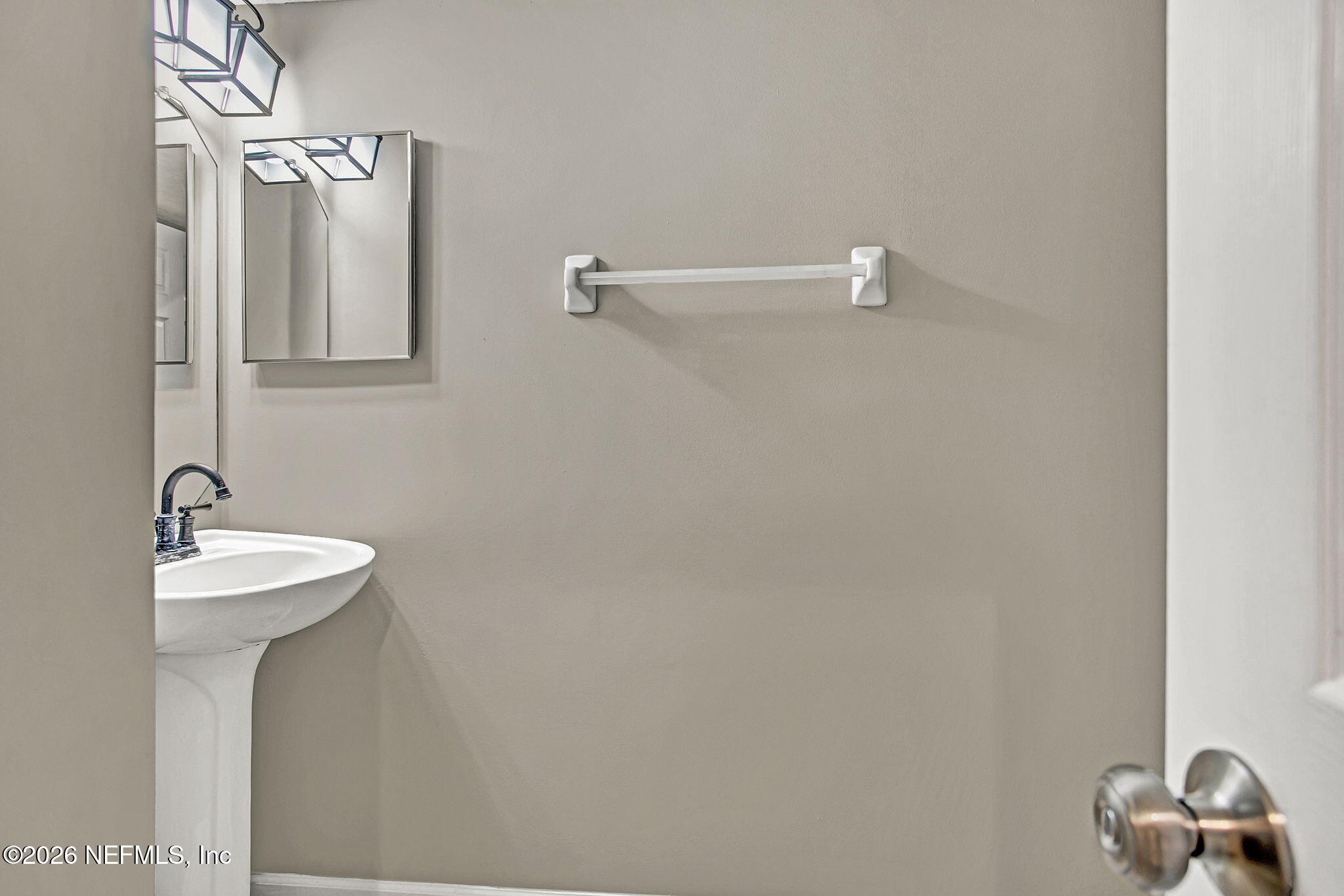 900 Country Bridge Road, Unit 3 St. Johns, FL 32259 - Photo 8 of 18 a bathroom with a sink and mirror