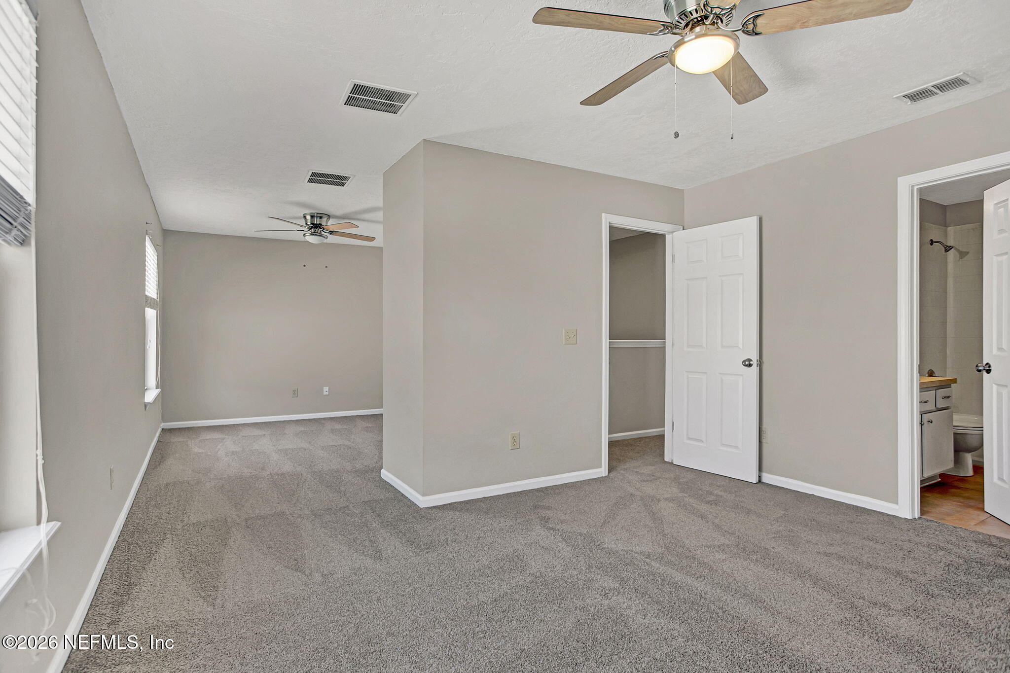 900 Country Bridge Road, Unit 3 St. Johns, FL 32259 - Photo 10 of 18 a view of an empty room with a chandelier fan