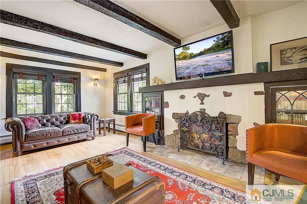 270 Middlesex Avenue Metuchen, NJ 08840 - Photo 11 of 54 a living room with furniture and a flat screen tv