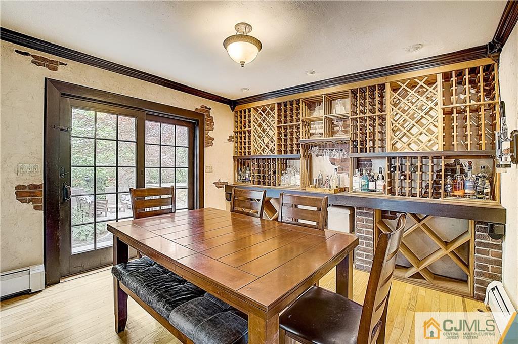 270 Middlesex Avenue Metuchen, NJ 08840 - Photo 12 of 54 a dining room with furniture and wooden floor