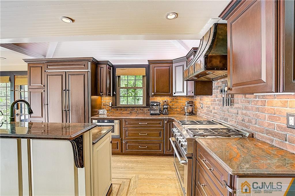 270 Middlesex Avenue Metuchen, NJ 08840 - Photo 17 of 54 a kitchen with stainless steel appliances granite countertop a sink stove and refrigerator