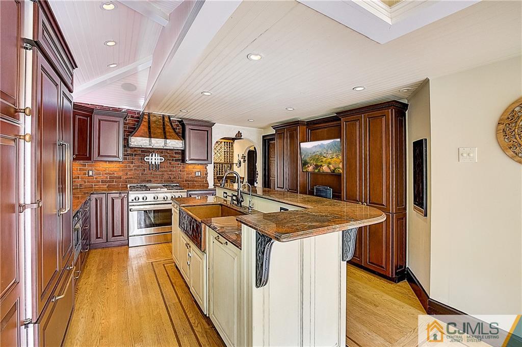 270 Middlesex Avenue Metuchen, NJ 08840 - Photo 19 of 54 a kitchen with stainless steel appliances granite countertop a sink stove and refrigerator