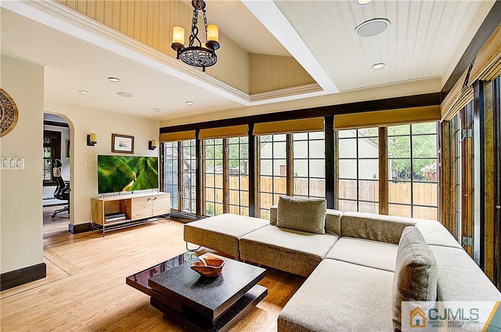 270 Middlesex Avenue Metuchen, NJ 08840 - Photo 22 of 54 a living room with furniture a flat screen tv and a large window