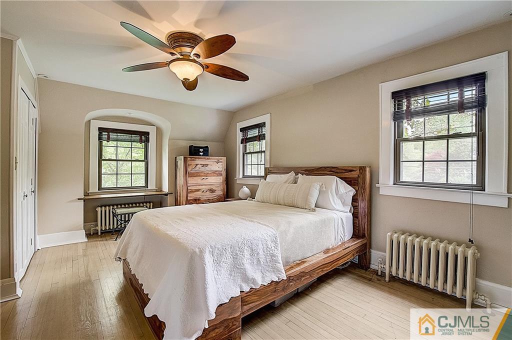 270 Middlesex Avenue Metuchen, NJ 08840 - Photo 28 of 54 a bedroom with a large bed and two windows