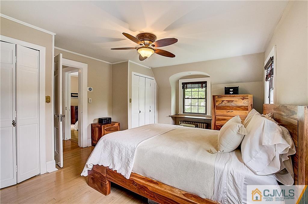 270 Middlesex Avenue Metuchen, NJ 08840 - Photo 29 of 54 a bedroom with a bed and a chandelier