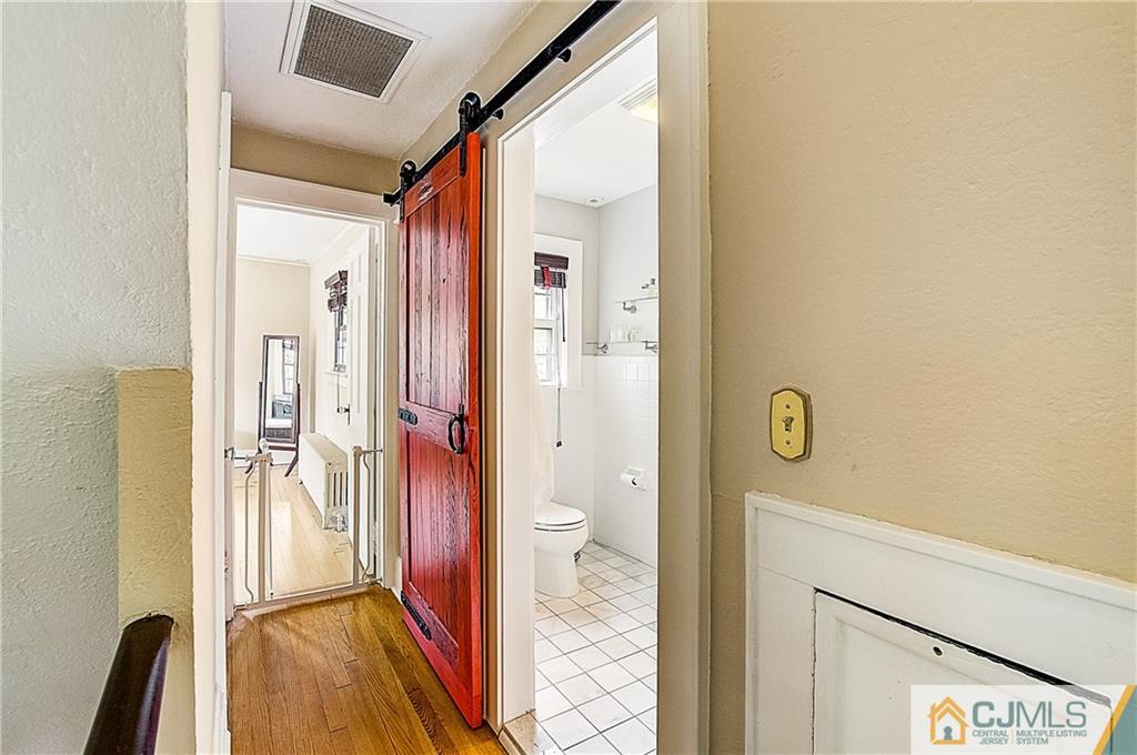 270 Middlesex Avenue Metuchen, NJ 08840 - Photo 32 of 54 a bathroom with a granite countertop sink and a mirror
