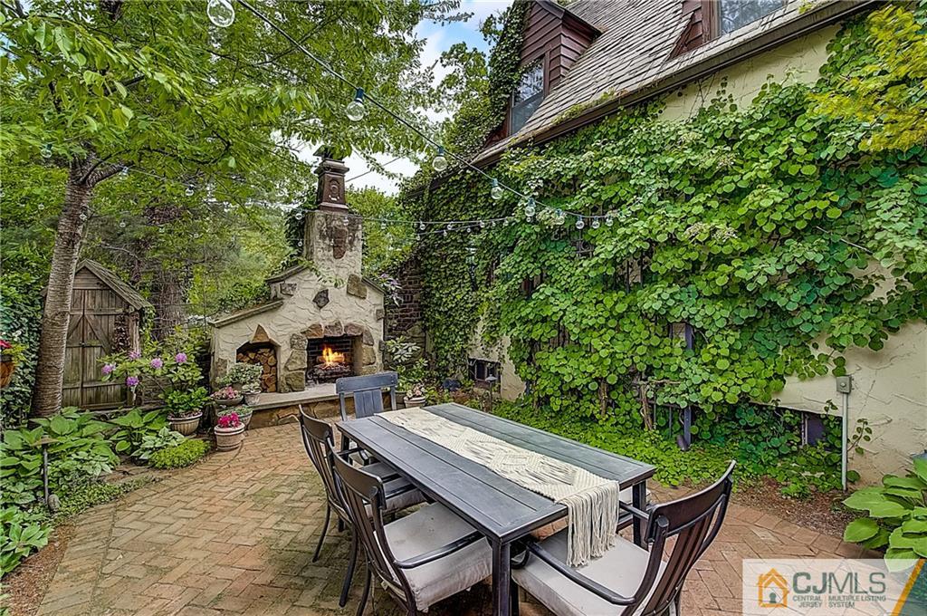 270 Middlesex Avenue Metuchen, NJ 08840 - Photo 45 of 54 a patio with table and chairs and potted plants
