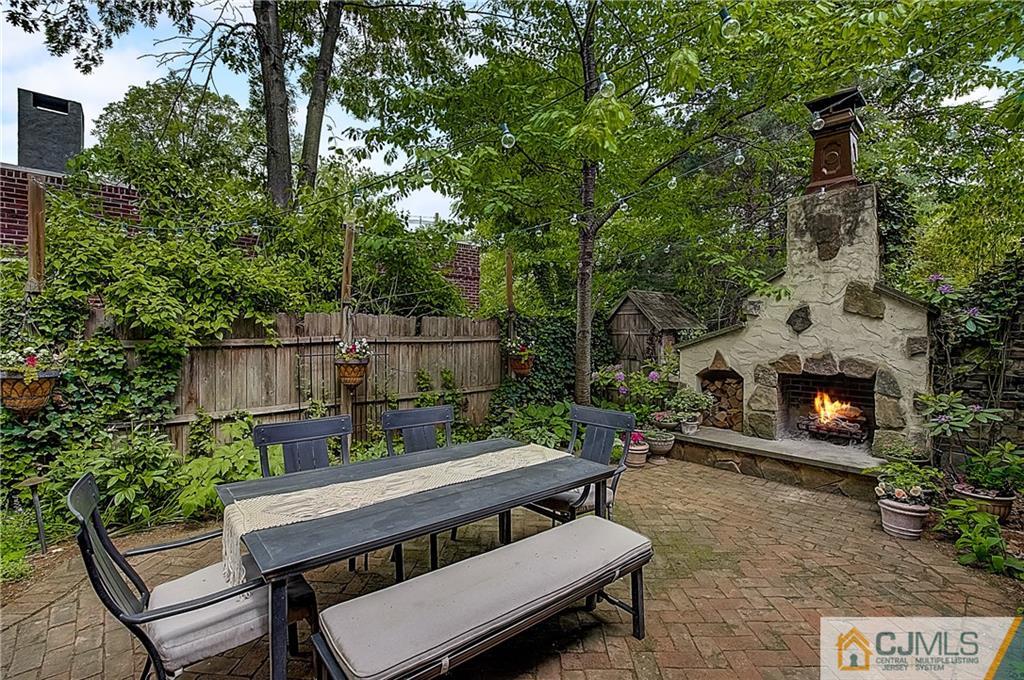 270 Middlesex Avenue Metuchen, NJ 08840 - Photo 46 of 54 a view of a chairs and table in the back yard of the house