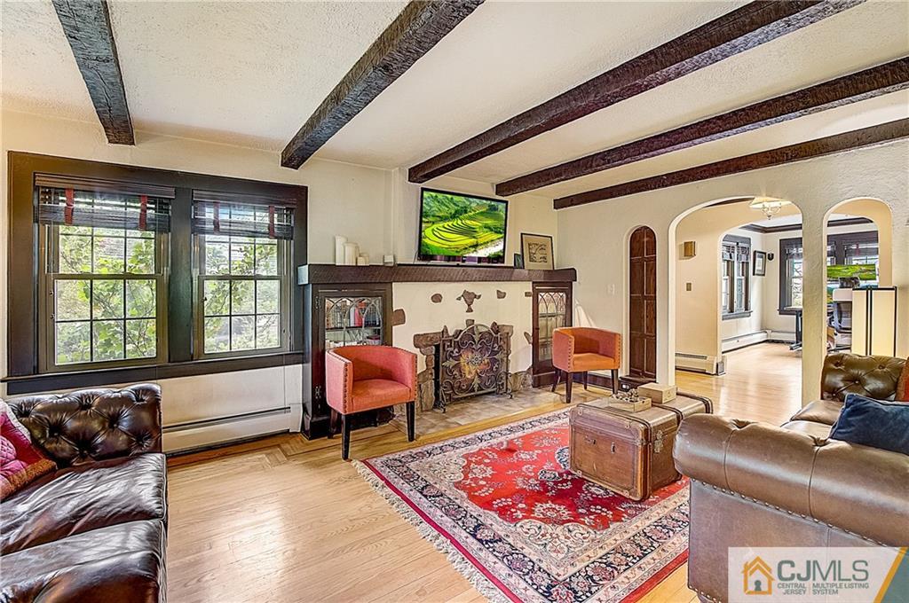 270 Middlesex Avenue Metuchen, NJ 08840 - Photo 7 of 54 a living room with furniture a rug and a fireplace