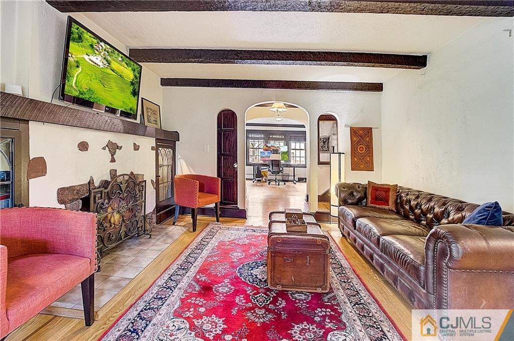 270 Middlesex Avenue Metuchen, NJ 08840 - Photo 8 of 54 a living room with furniture and a flat screen tv