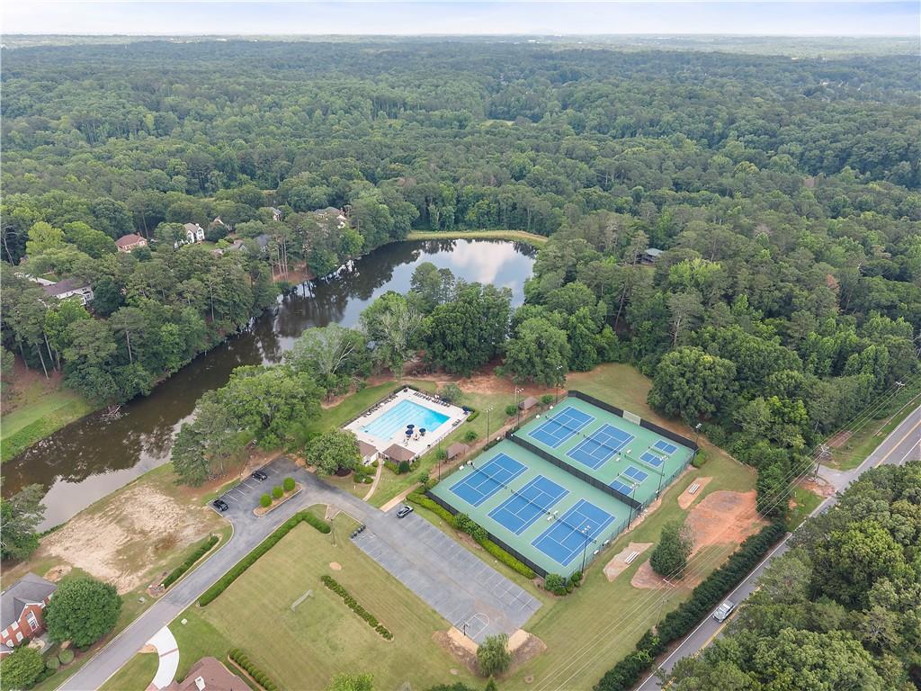 8965 Laurel Way Alpharetta, GA 30022 - Photo 69 of 79 an aerial view of a house with a yard